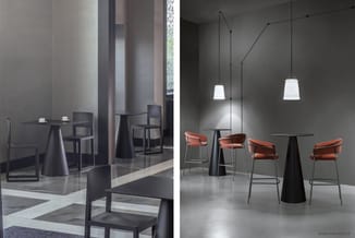 Moderne kantoorruimte met zwarte kegelvormige tafels, zwarte stoelen, terracotta barkrukken en hangende witte trapeziumvormig