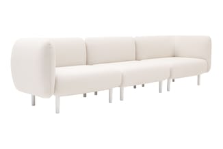 Crème witte modulaire sofa met afgeronde vormen, cylindrische armleuningen en witte poten tegen witte achtergrond.