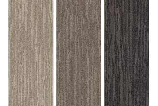 Drie stalen tapijttegels in verticaal streeppatroon, van links naar rechts in beige, taupe en donkergrijs.